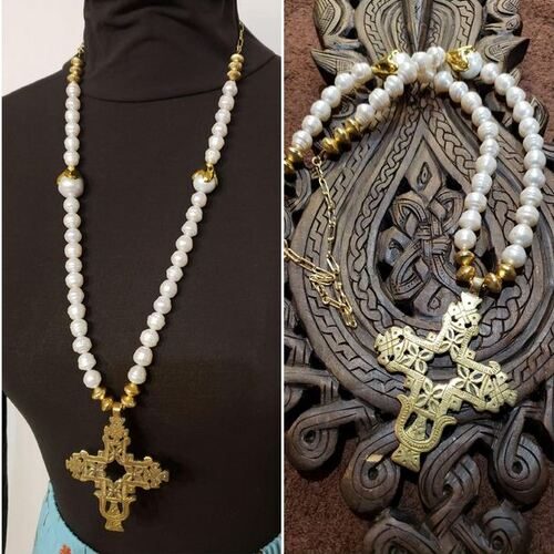 Brass cross, pearls strung on leather